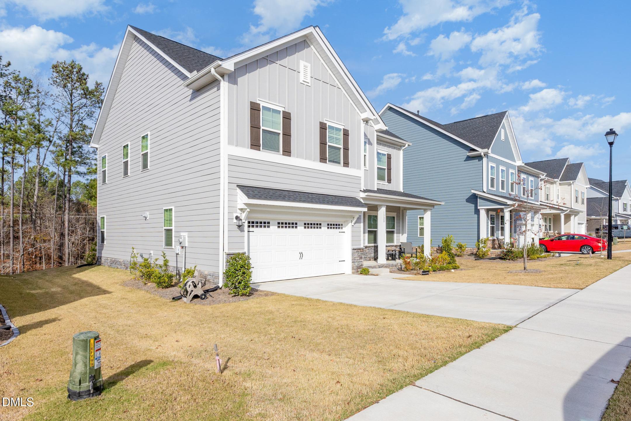 1328 Hazelnut Ridge Lane Knightdale, NC 27545 - Photo 3 of 50 a view of a street with buildings