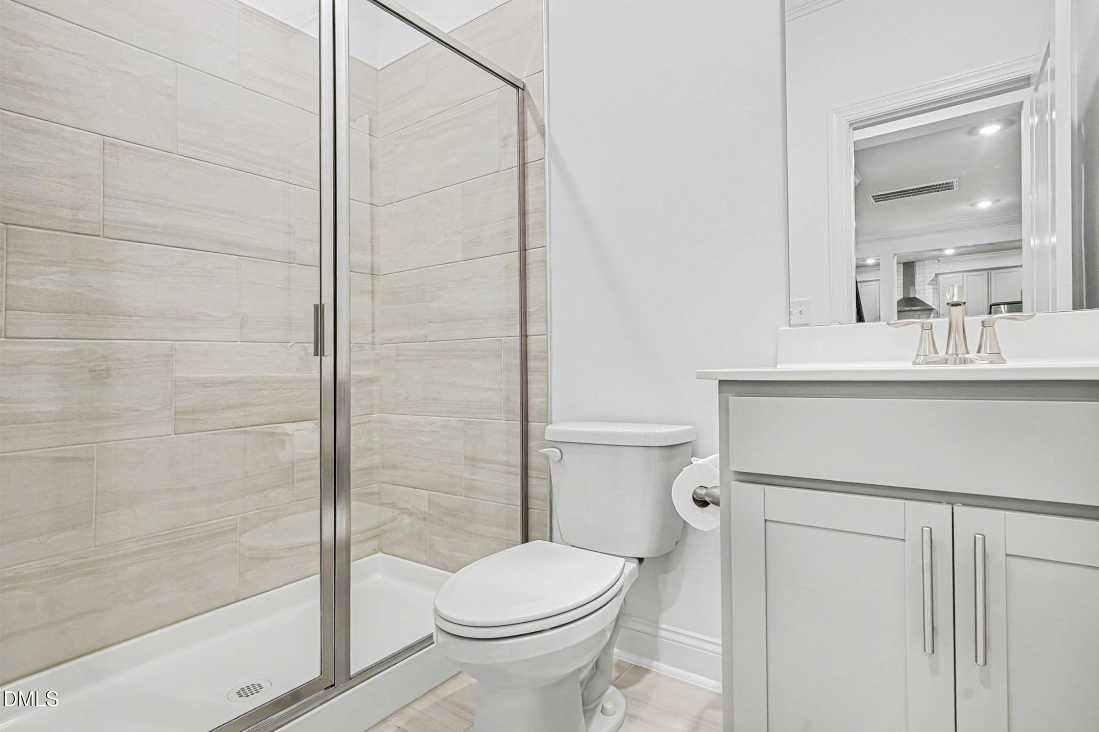 1328 Hazelnut Ridge Lane Knightdale, NC 27545 - Photo 31 of 50 a bathroom with a sink toilet and shower