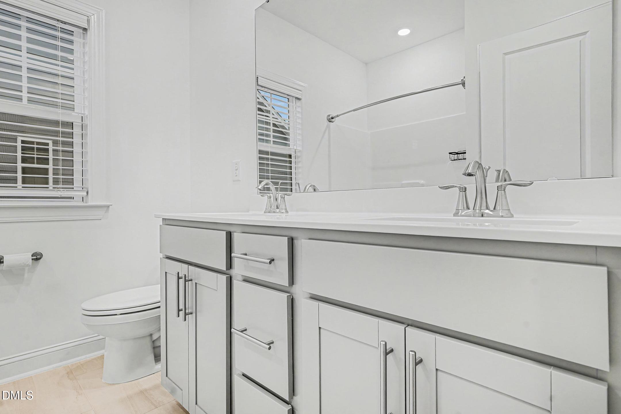 1328 Hazelnut Ridge Lane Knightdale, NC 27545 - Photo 37 of 50 a bathroom with a sink toilet and shower