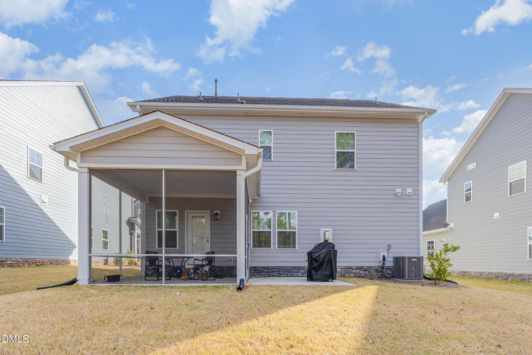 1328 Hazelnut Ridge Lane Knightdale, NC 27545 - Photo 47 of 50 a front view of a house with a patio