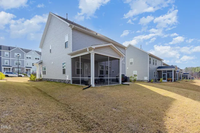 a view of a house with a yard and garage