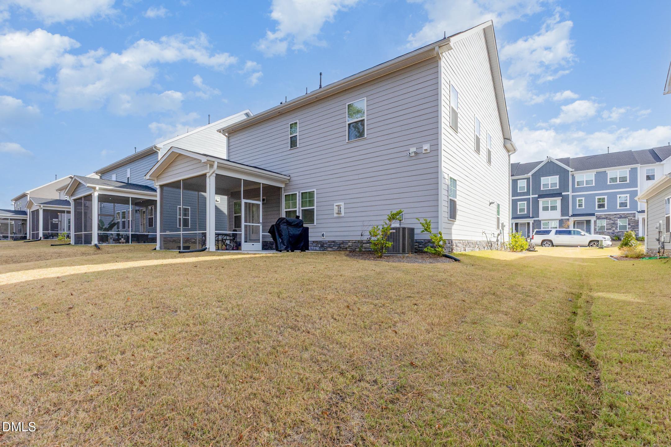 1328 Hazelnut Ridge Lane Knightdale, NC 27545 - Photo 49 of 50 a house view with a swimming pool