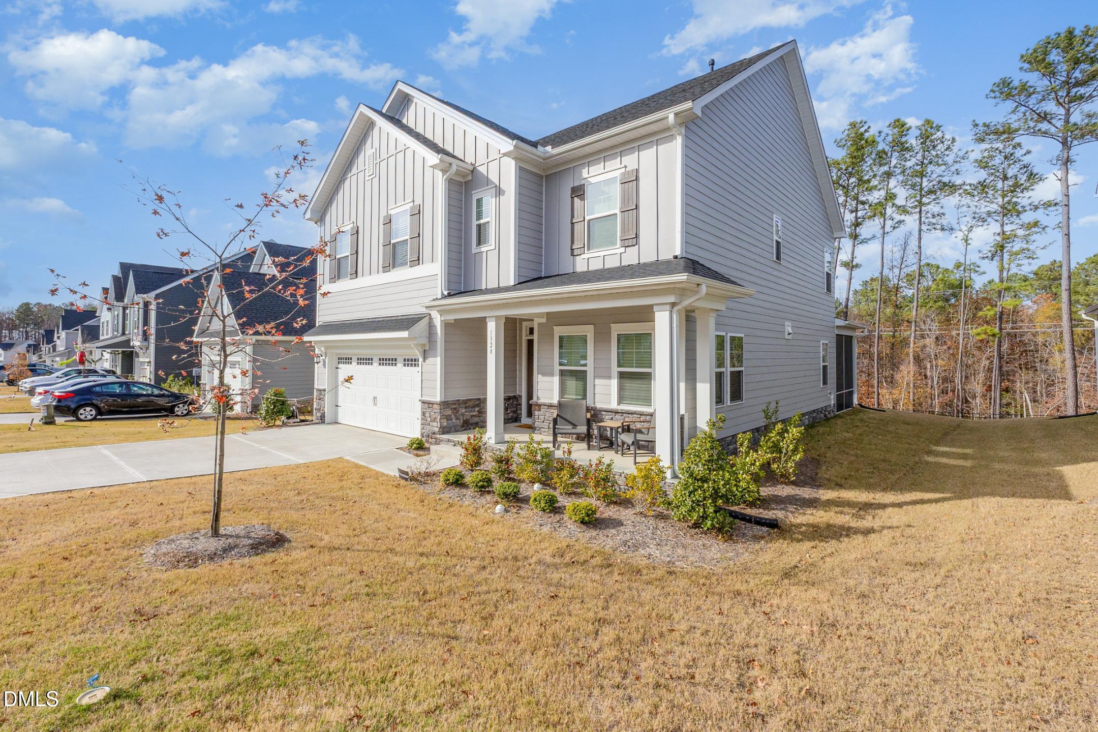 1328 Hazelnut Ridge Lane Knightdale, NC 27545 - Photo 5 of 50 a front view of a house with a yard