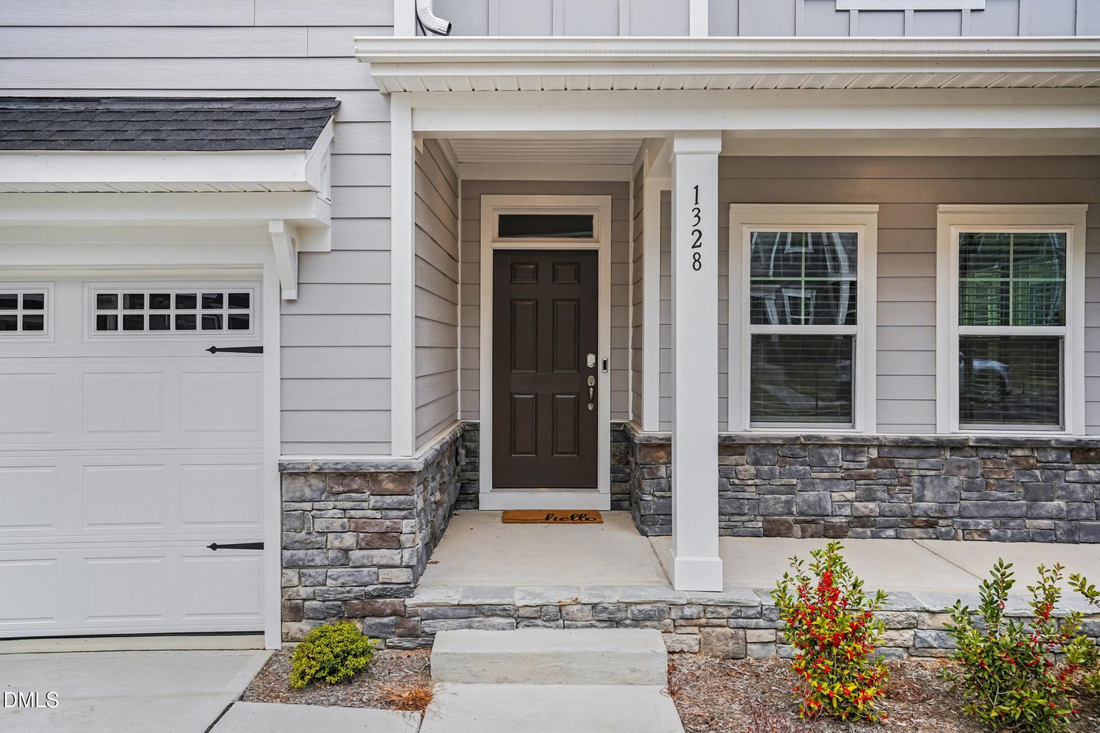 1328 Hazelnut Ridge Lane Knightdale, NC 27545 - Photo 8 of 50 a front view of a house with a yard