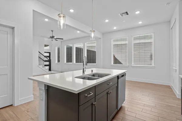a kitchen with a sink and a window