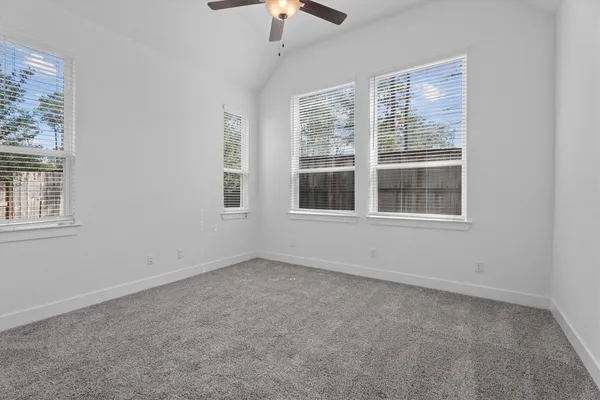 a view of empty room with windows