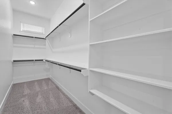 a view of an empty walk in closet