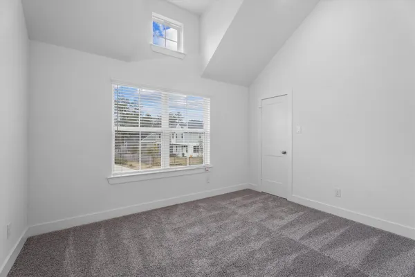 a view of house with small yard