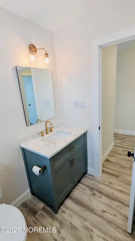 a bathroom with a sink and mirror