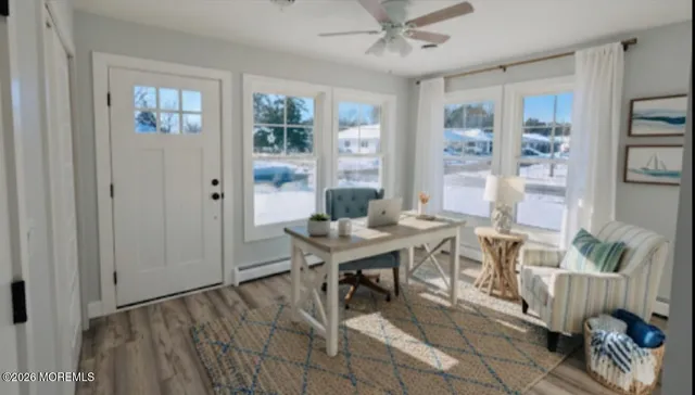 a view of a livingroom with furniture and a window