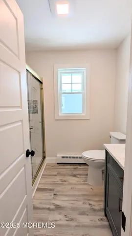 a bathroom with a sink a toilet and tub
