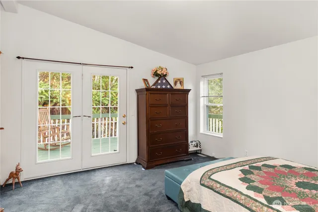 a view of bedroom with furniture and window