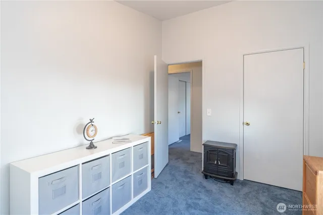 a view of a bathroom with sink mirror and window