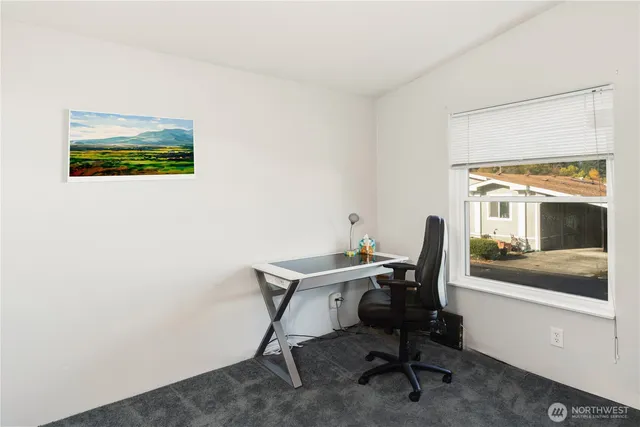 a view of a workspace with furniture