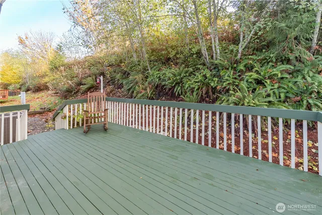 a view of deck with wooden floor and fence