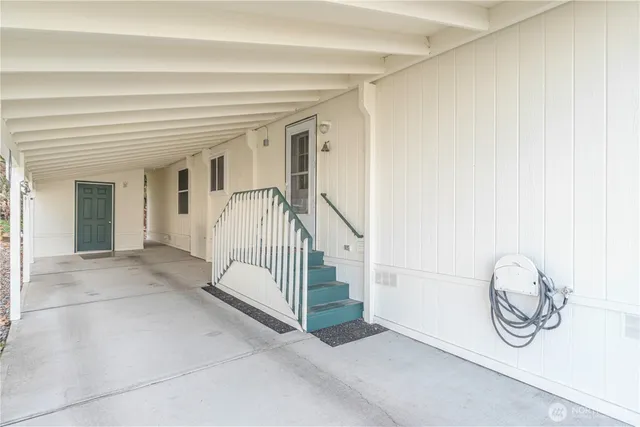 a view of a hallway with staircase