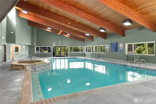 a view of a swimming pool with a patio