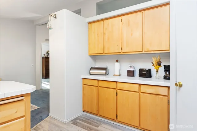 a kitchen with stainless steel appliances a refrigerator and a sink