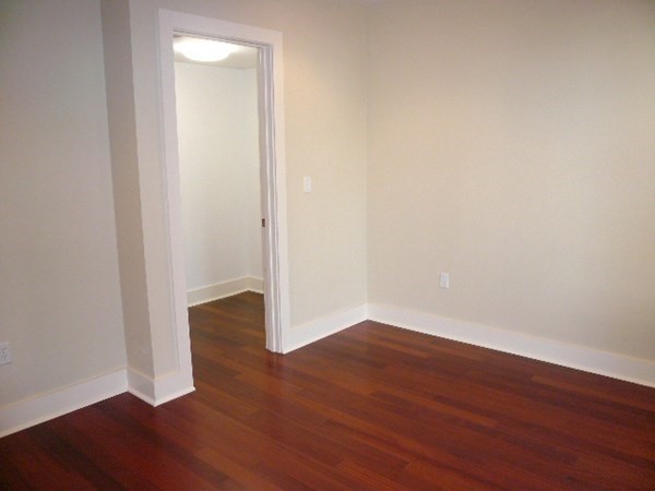 533 Cambridge Street, Unit 212 Boston, MA 02134 - Photo 5 of 7 a view of an empty room with wooden floor
