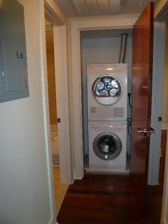 533 Cambridge Street, Unit 212 Boston, MA 02134 - Photo 7 of 7 a view of a hallway with washer and dryer