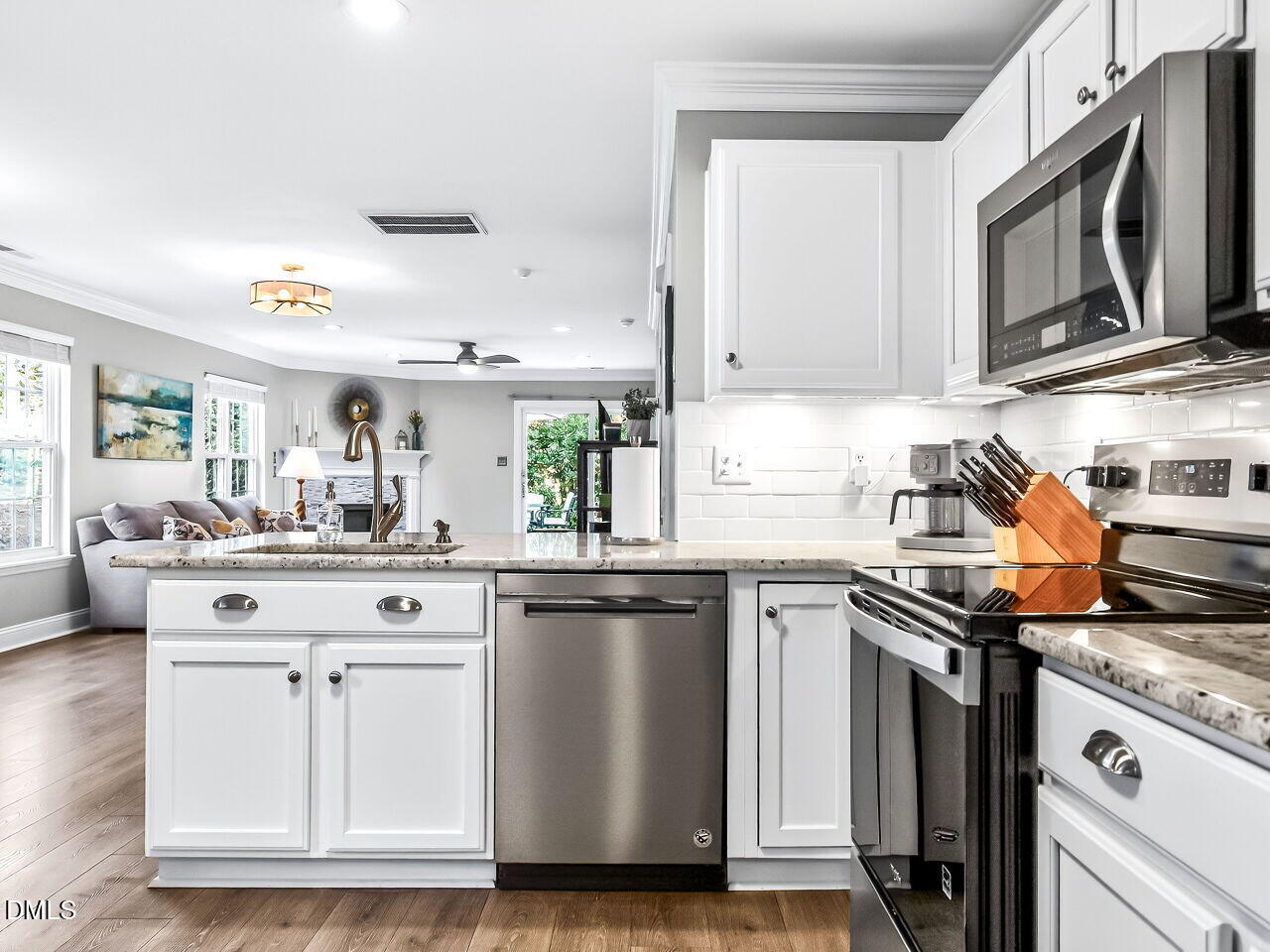 422 Intern Way Durham, NC 27713 - Photo 12 of 33 a kitchen with stainless steel appliances granite countertop a sink and a stove
