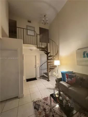 a view of entryway and kitchen