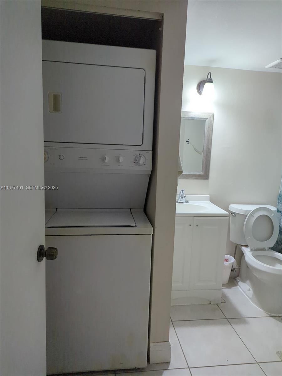8205 Southwest 152nd Avenue, Unit F414 Miami, FL 33193 - Photo 13 of 13 a utility room with dryer and washer