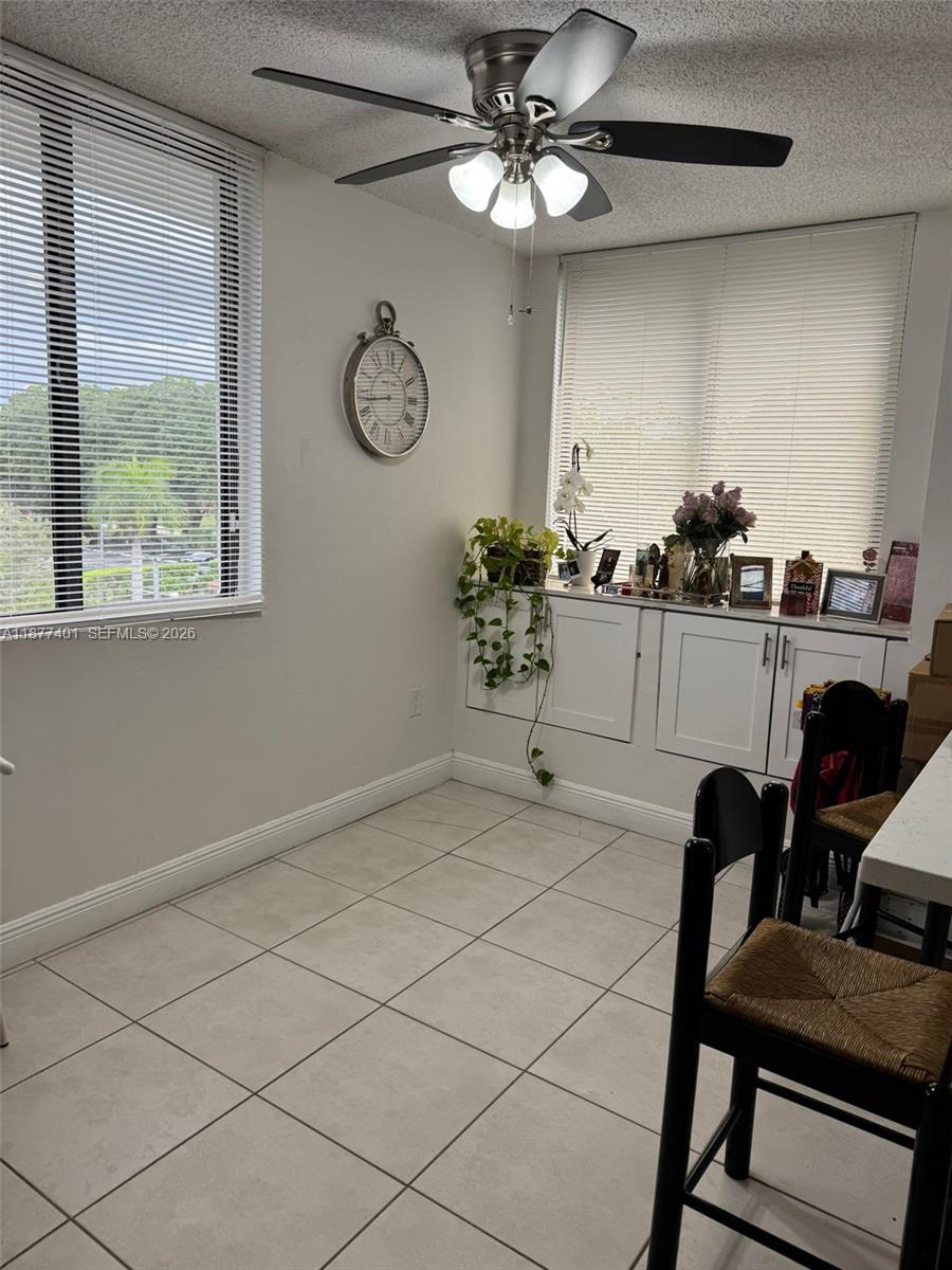 8205 Southwest 152nd Avenue, Unit F414 Miami, FL 33193 - Photo 3 of 13 a view of a livingroom with furniture and a chandelier