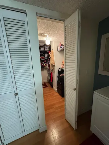 a view of a livingroom with an empty space and a window