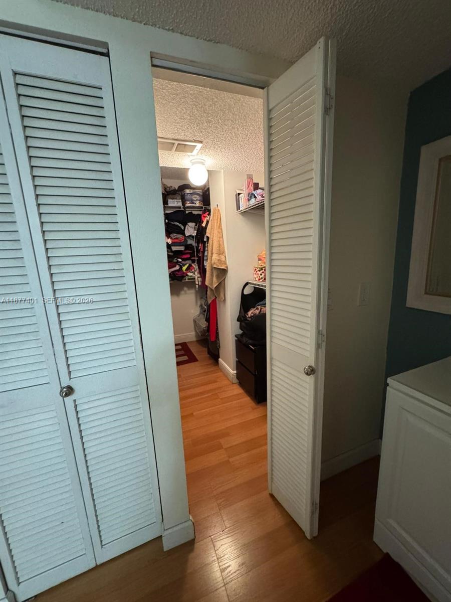 8205 Southwest 152nd Avenue, Unit F414 Miami, FL 33193 - Photo 4 of 13 a view of a livingroom with an empty space and a window