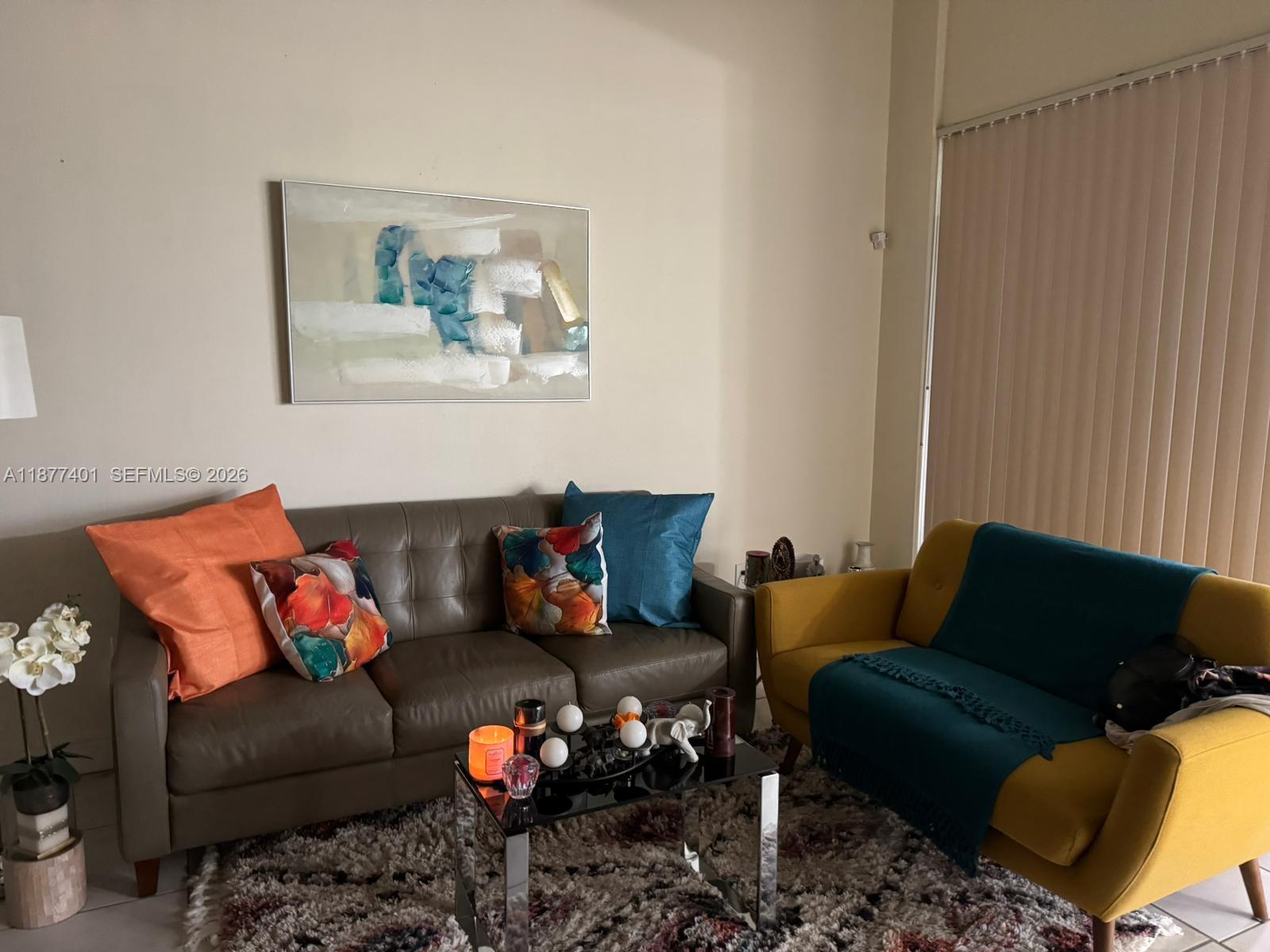 8205 Southwest 152nd Avenue, Unit F414 Miami, FL 33193 - Photo 8 of 13 a living room with furniture and a couch