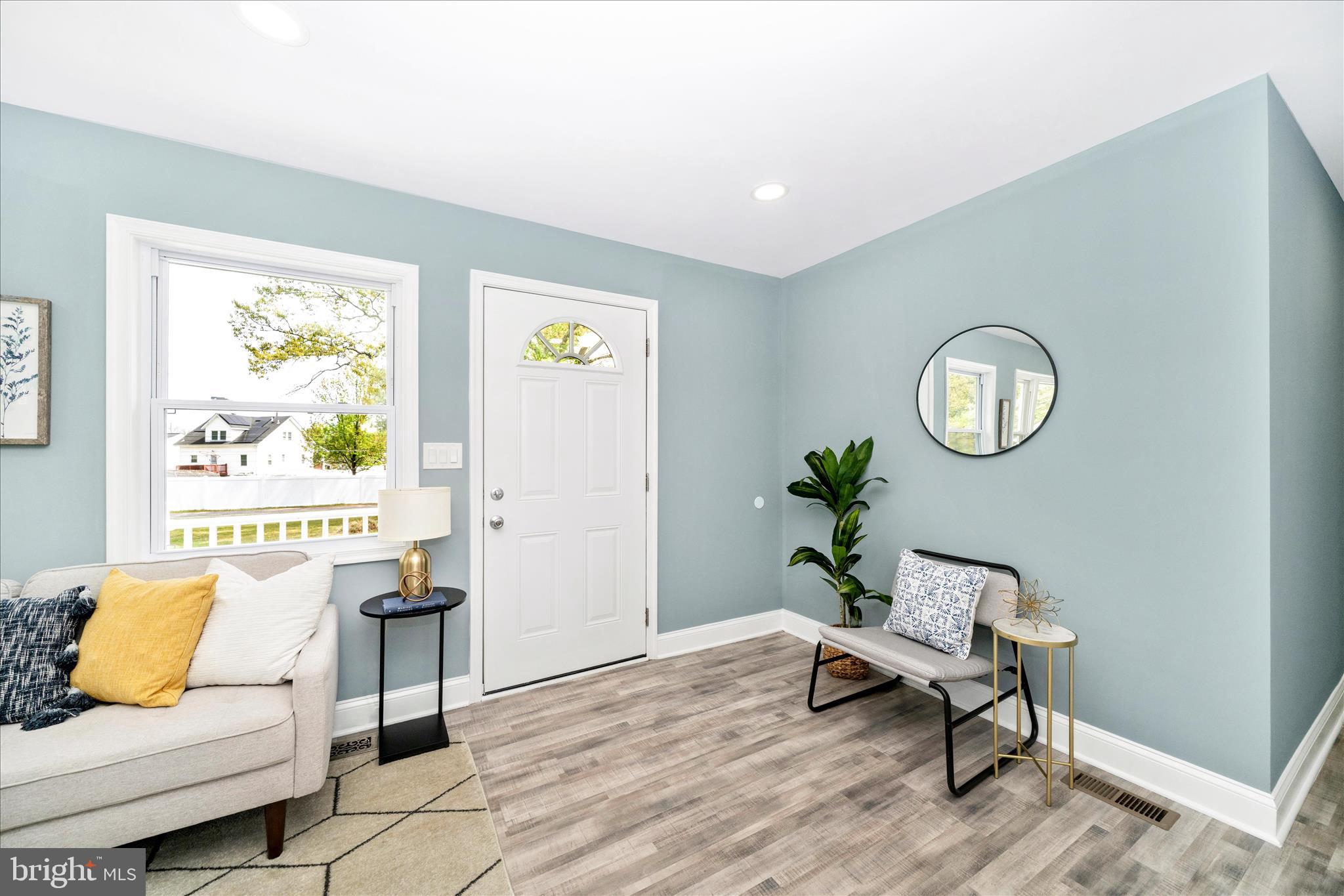 6737 Allentown Road Temple Hills, MD 20748 - Photo 15 of 51 a living room with furniture and a potted plant