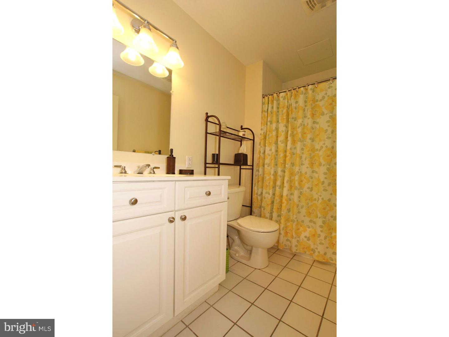 1900 Hamilton Street, Unit D19 Philadelphia, PA 19130 - Photo 20 of 25 a bathroom with a sink a toilet and shower