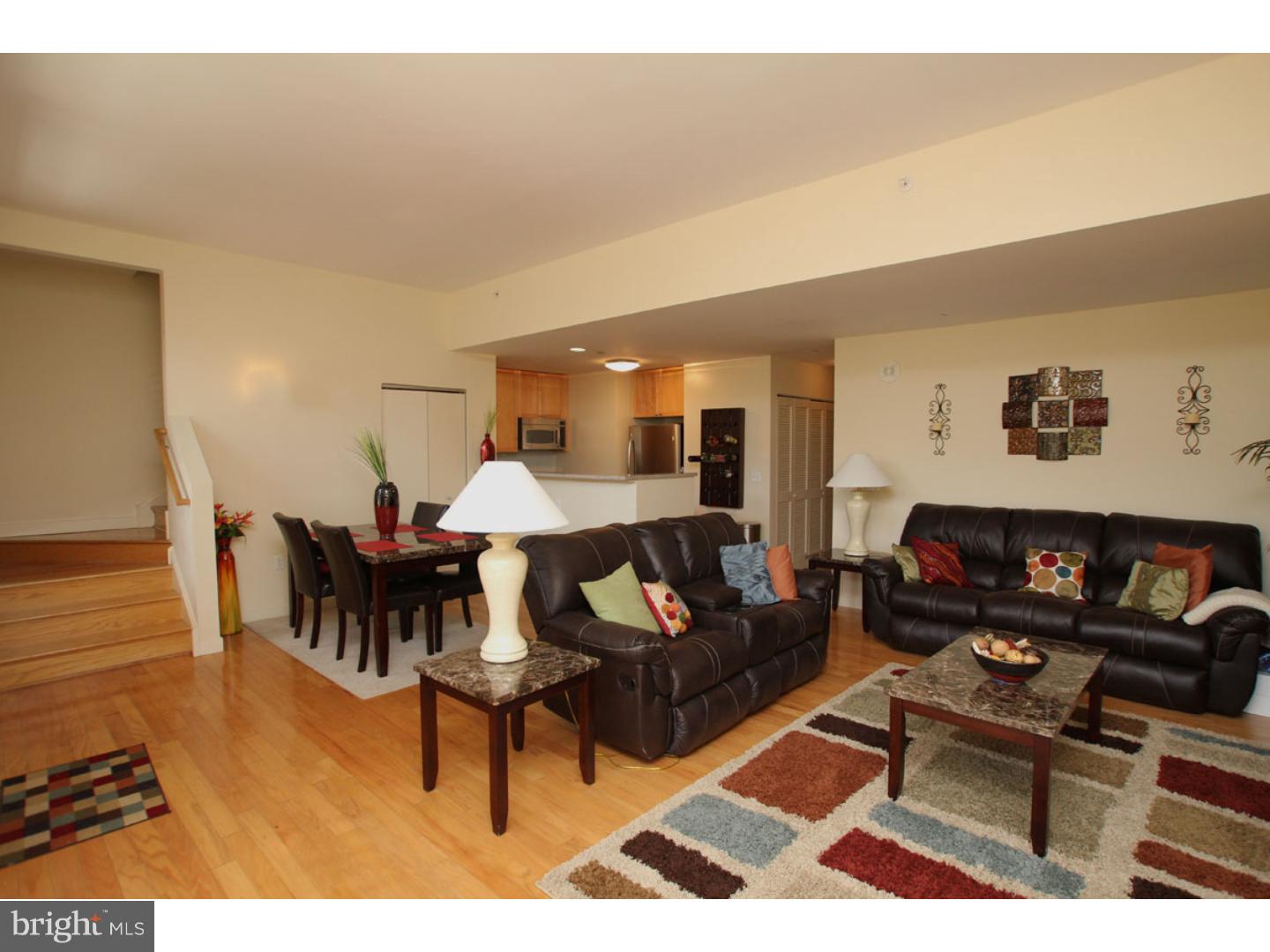 1900 Hamilton Street, Unit D19 Philadelphia, PA 19130 - Photo 5 of 25 a living room with furniture and wooden floor