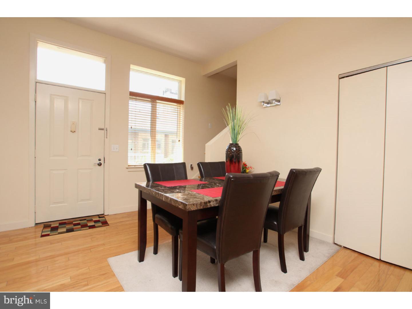 1900 Hamilton Street, Unit D19 Philadelphia, PA 19130 - Photo 7 of 25 a view of a dining room with furniture and window