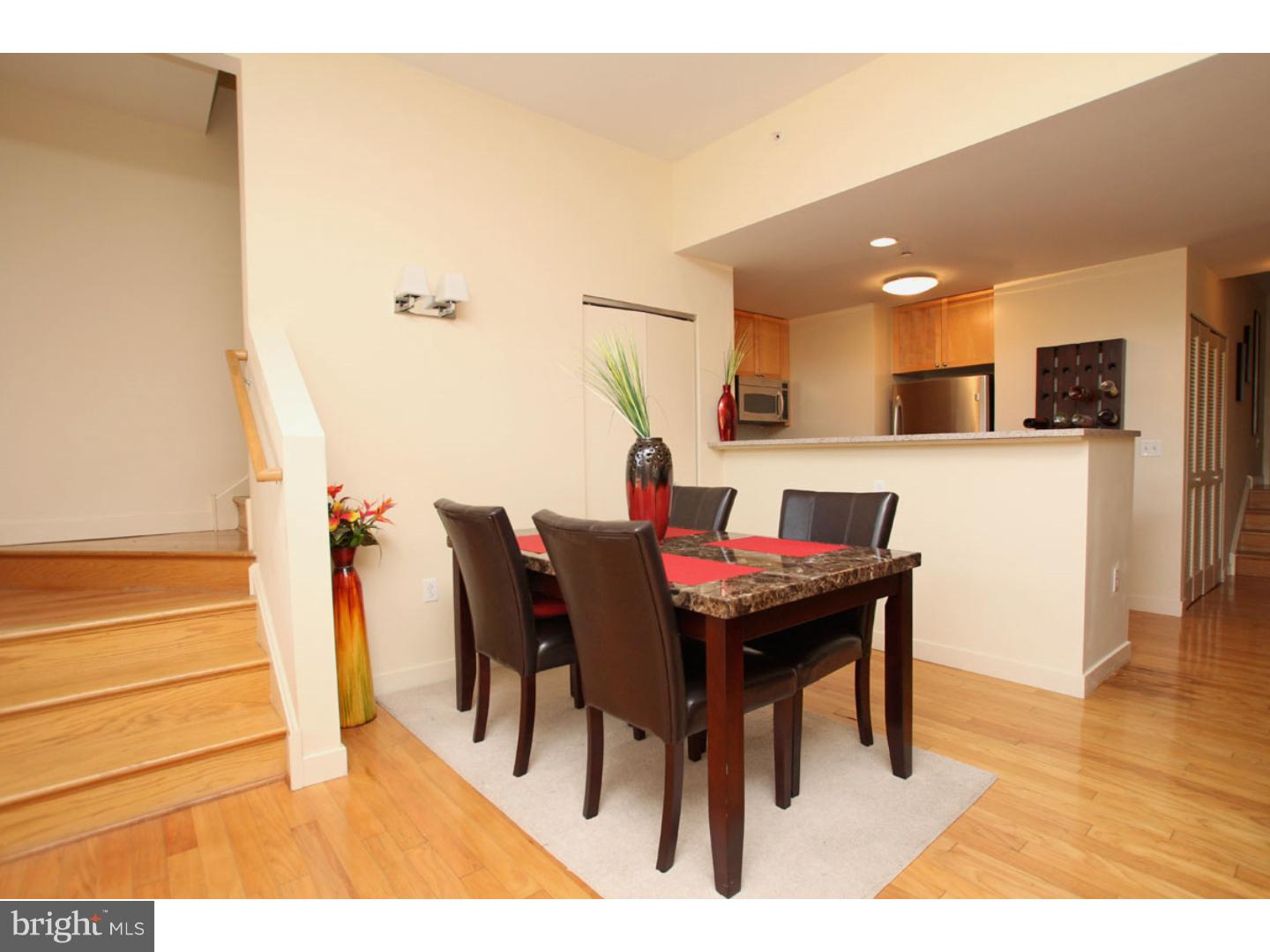 1900 Hamilton Street, Unit D19 Philadelphia, PA 19130 - Photo 8 of 25 a view of a dining room with furniture and wooden floor