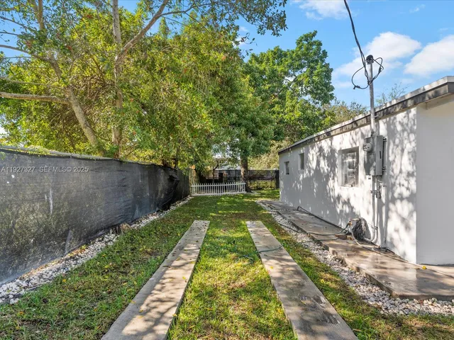 a backyard of a house with lots of green space