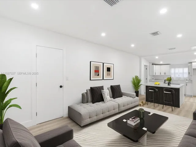 a living room with furniture and a couch