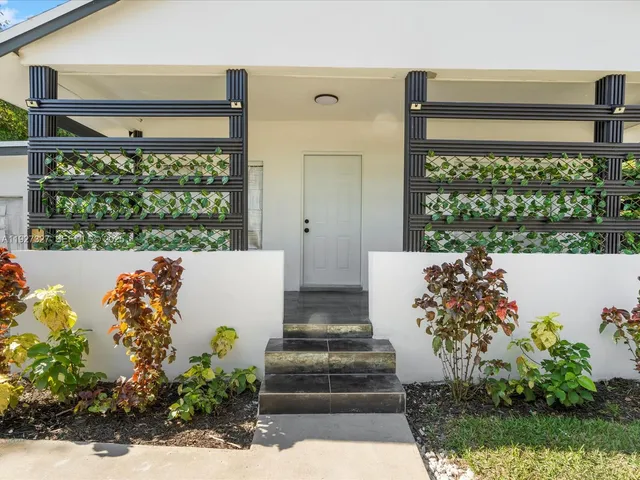 a view of a porch with a dining table