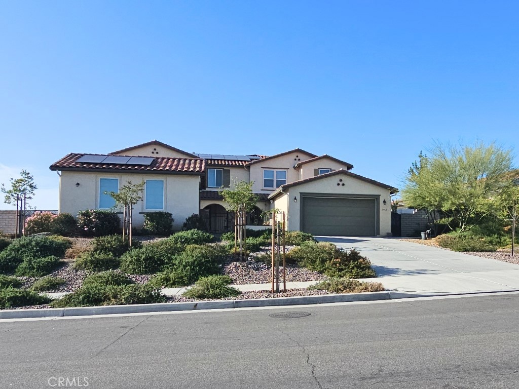 13952 Lily Lane Riverside, CA 92503 - Photo 1 of 42 a front view of a house with a yard and garage