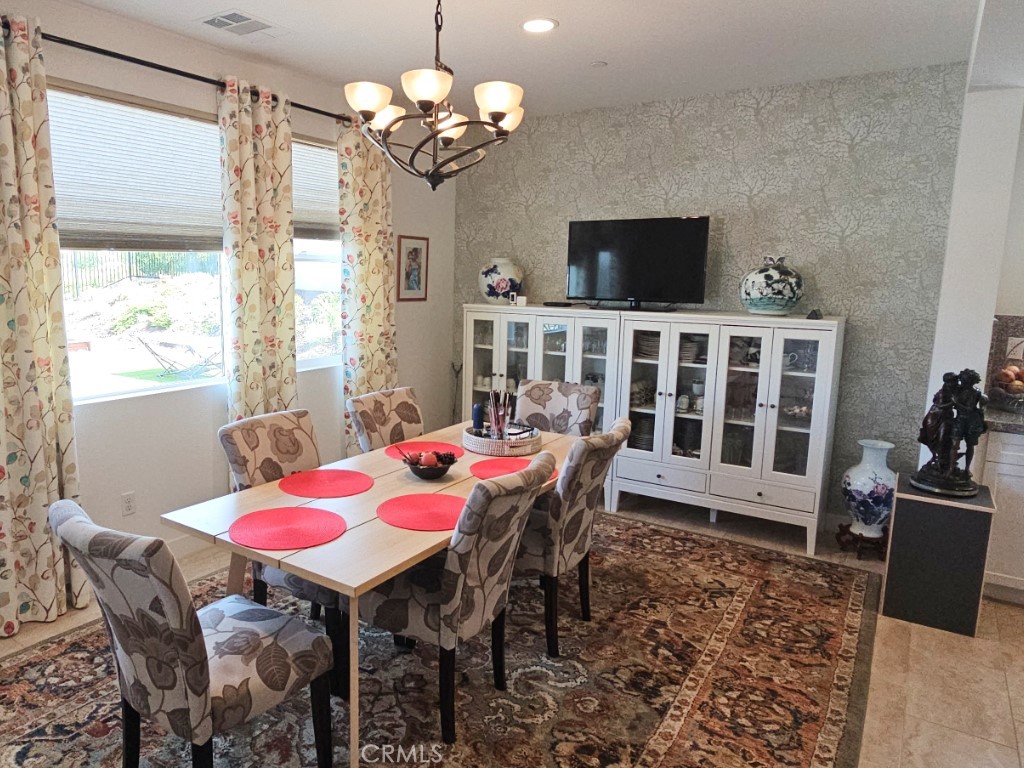13952 Lily Lane Riverside, CA 92503 - Photo 13 of 42 a view of a dining room with furniture window and wooden floor