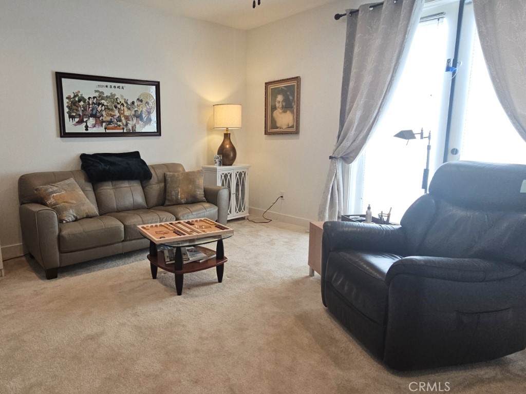 13952 Lily Lane Riverside, CA 92503 - Photo 15 of 42 a living room with furniture a couch and a window