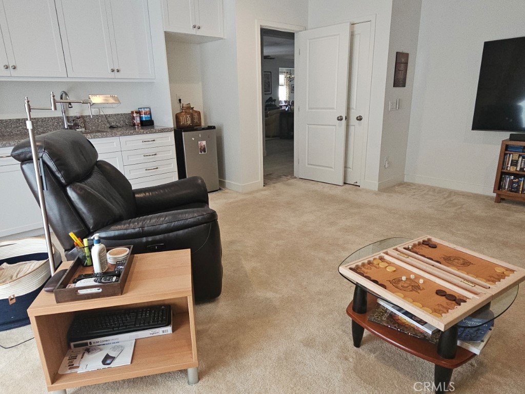 13952 Lily Lane Riverside, CA 92503 - Photo 16 of 42 a living room with furniture and a flat screen tv