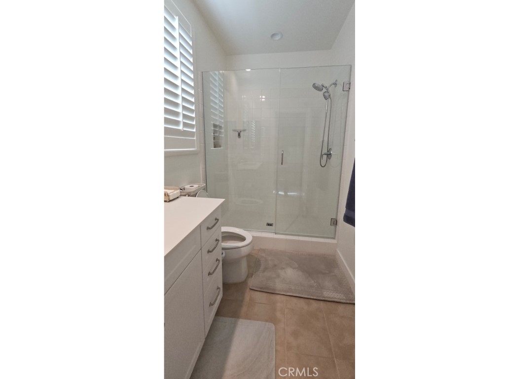 13952 Lily Lane Riverside, CA 92503 - Photo 17 of 42 a bathroom with a sink a toilet and shower