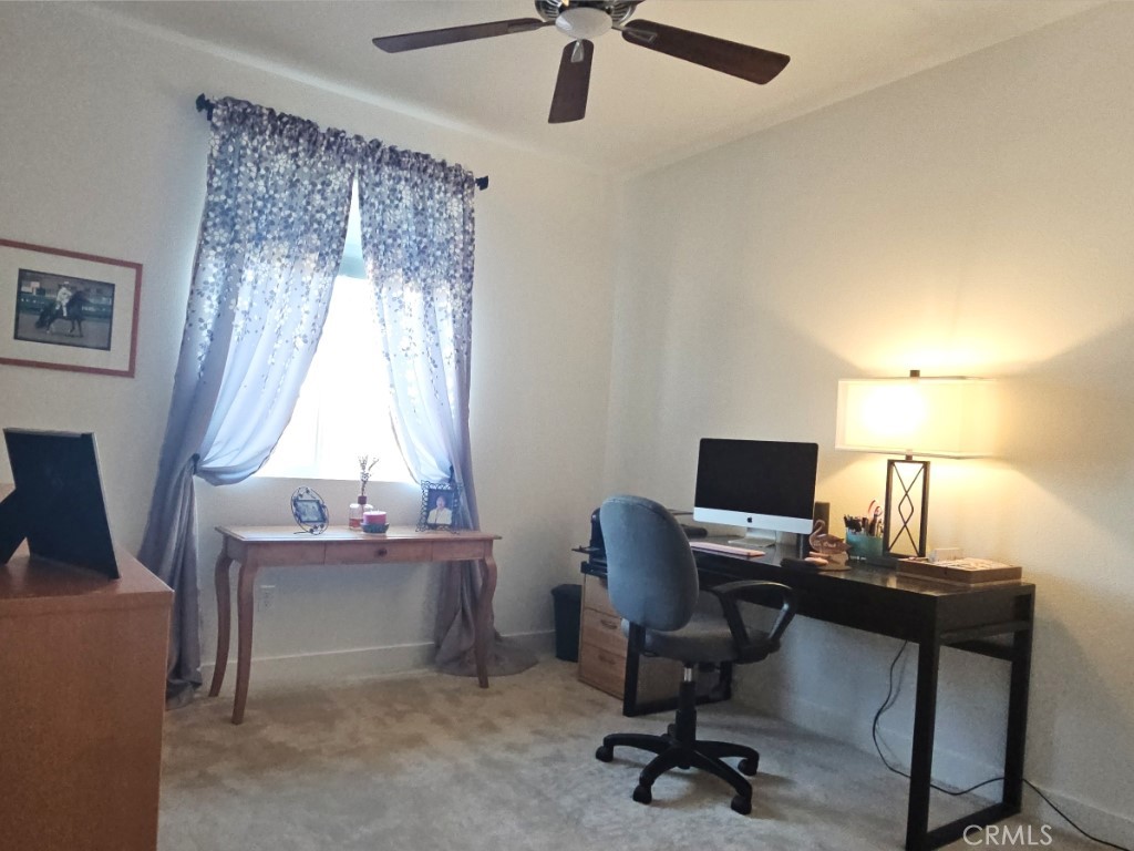 13952 Lily Lane Riverside, CA 92503 - Photo 21 of 42 a view of a workspace with furniture and a window