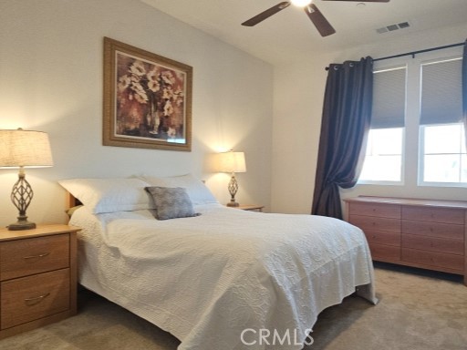 13952 Lily Lane Riverside, CA 92503 - Photo 23 of 42 a bedroom with a bed and a painting on the wall