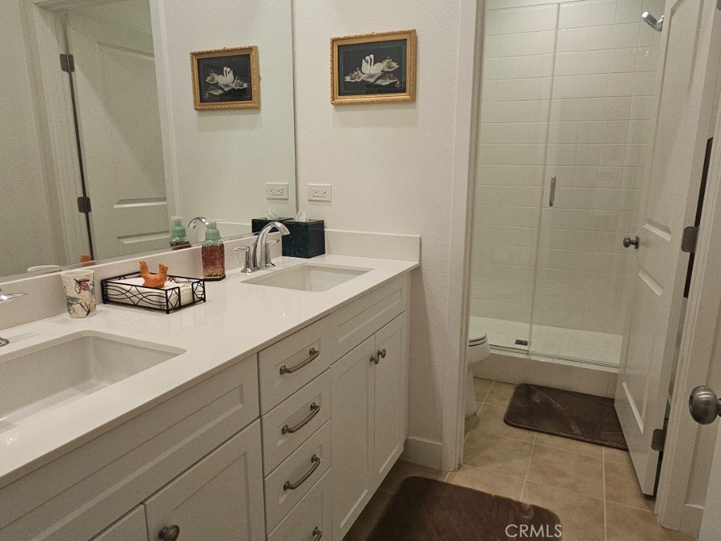 13952 Lily Lane Riverside, CA 92503 - Photo 26 of 42 a bathroom with a sink and a mirror