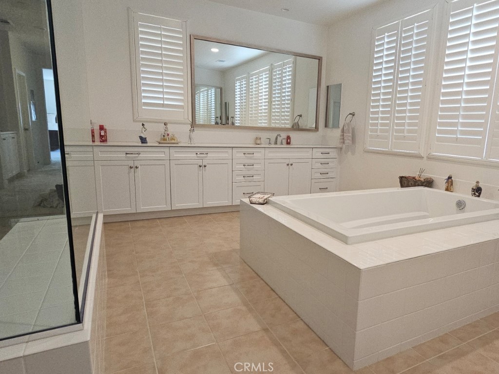 13952 Lily Lane Riverside, CA 92503 - Photo 28 of 42 a bathroom with a sink and a bathtub
