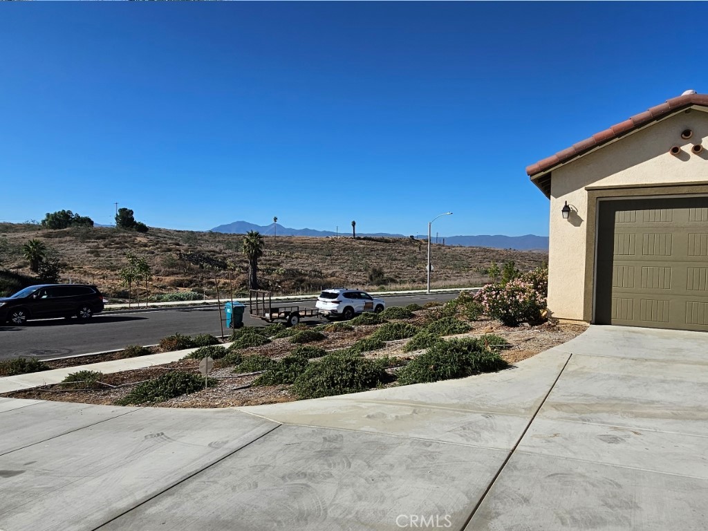 13952 Lily Lane Riverside, CA 92503 - Photo 5 of 42 a view of a road with a building in the background