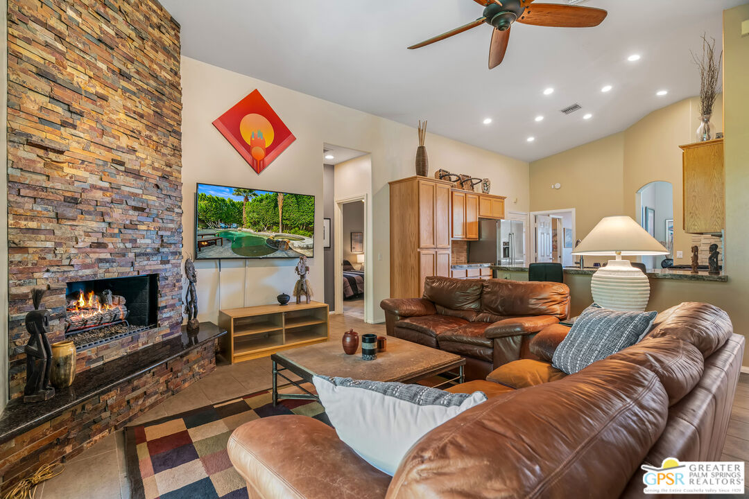 67860 Ontina Road Cathedral City, CA 92234 - Photo 16 of 48 a living room with furniture and a fireplace